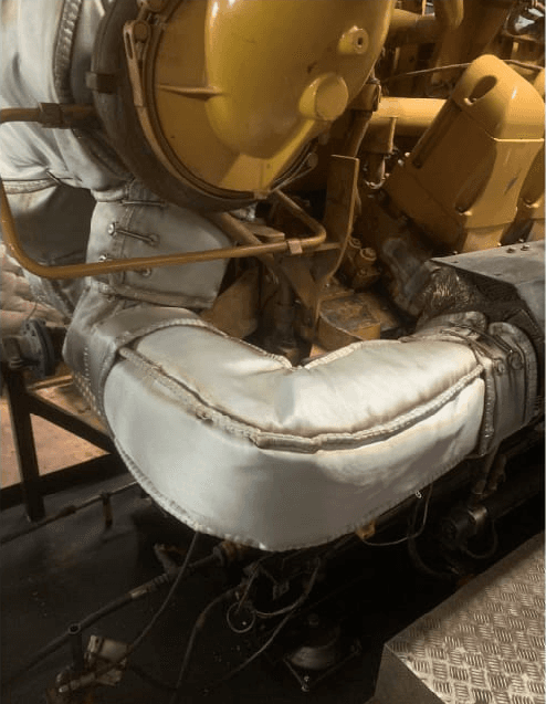 Custom thermal insulation cover for Caterpillar G3516C generator, improving efficiency by reducing heat loss and protecting personnel from high-temperature surfaces.