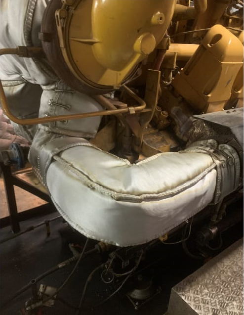 Custom thermal insulation cover for Caterpillar G3516C generator, improving efficiency by reducing heat loss and protecting personnel from high-temperature surfaces.